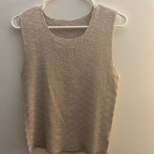 A champagne metallic color, very pretty, dress up or down, tank top.